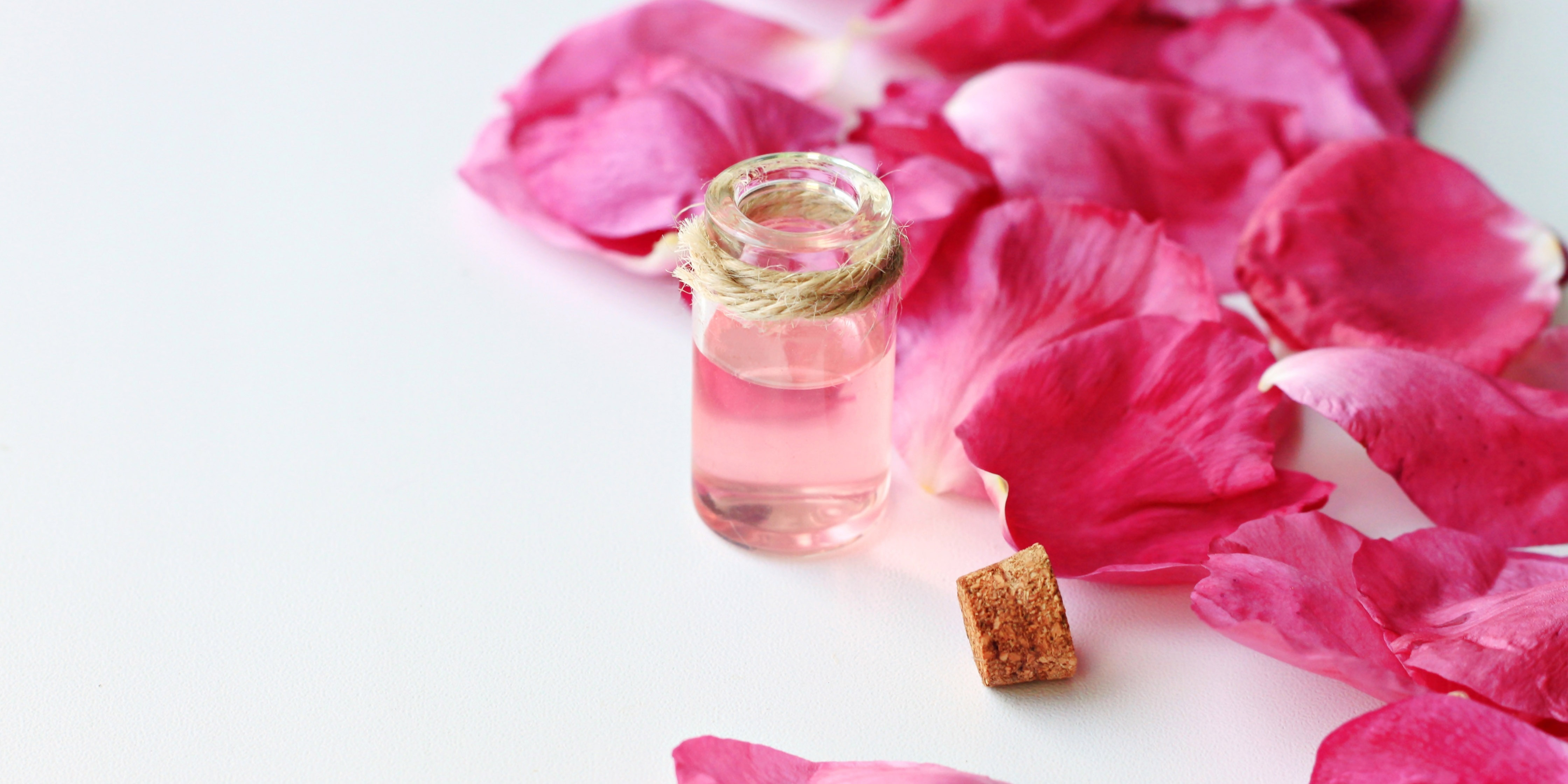 pink aromatic fluid oil rose petals, anti-stress treatment with essential oils